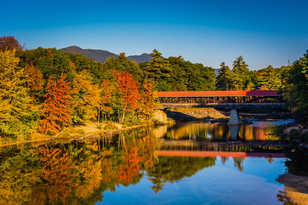 New Hampshire covered bridge surrounded by fall foliage